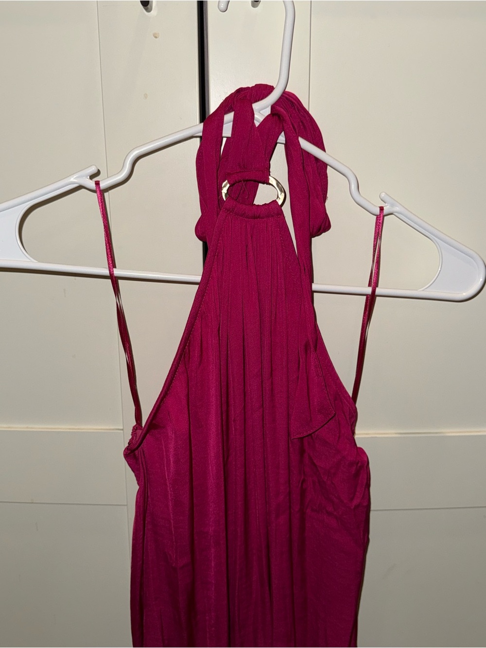 Halter dress with gold emblem